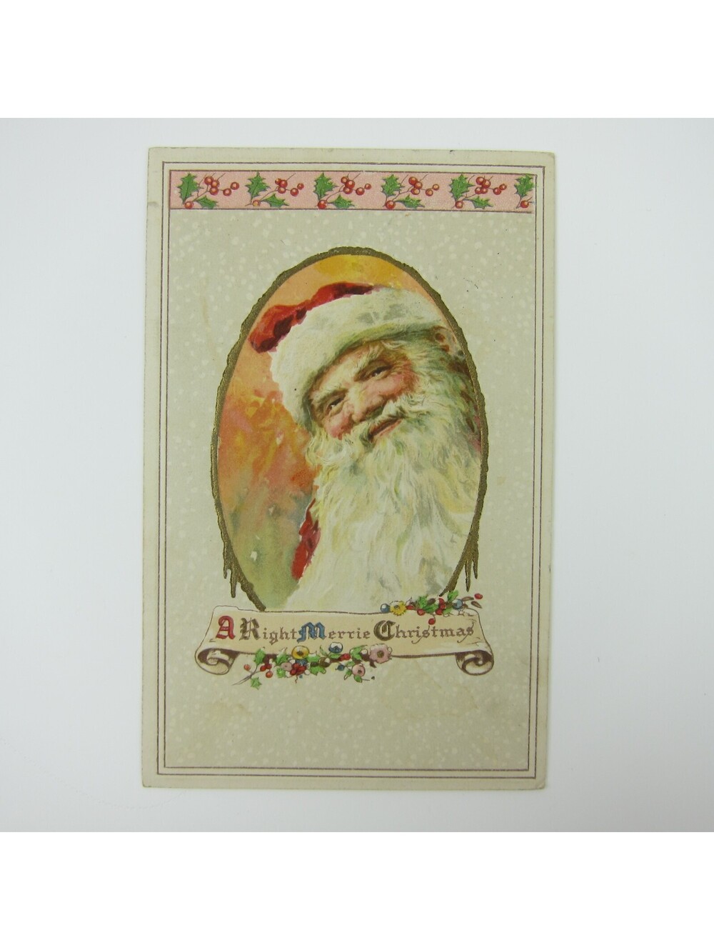 Vintage Christmas Postcard Santa Smiles Holly Berries Flowers Embossed Antique